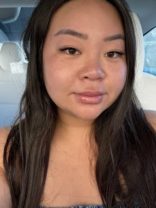 Client selfie showing lash extensions, shared by Crystal W. on Yelp